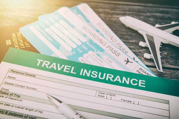 Travel insurance form with boarding passes and toy airplane