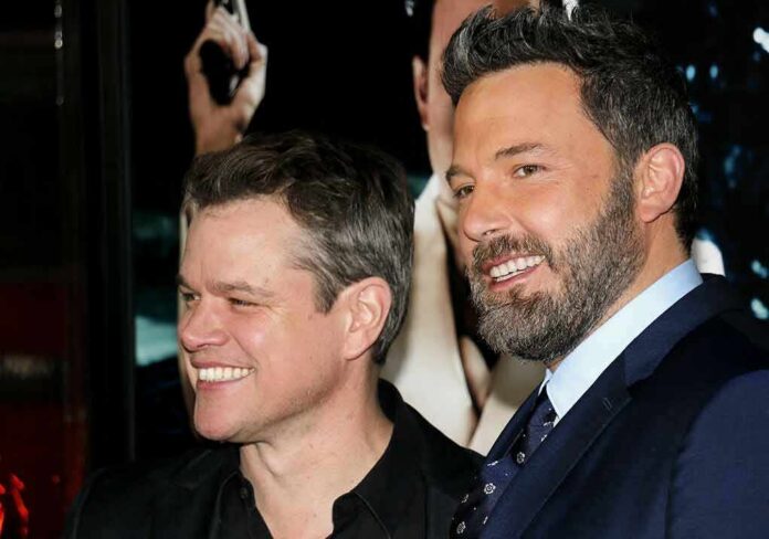 two men smiling at an event