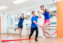 Trainer Arrested After Disturbing Phone Find Three adults practicing slacklining indoors